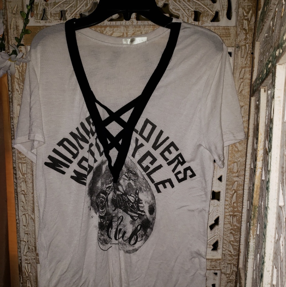 White and black graphic tee with crisscross front